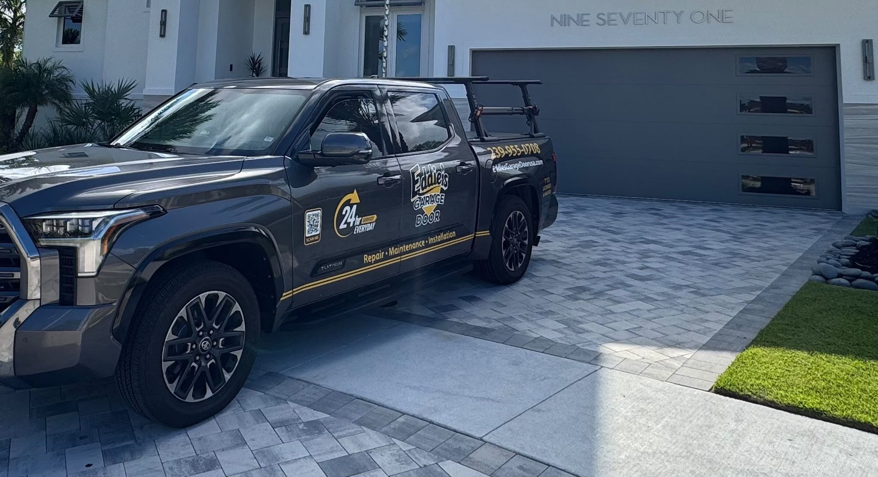 Eddie's Garage Door service truck at a customer's home