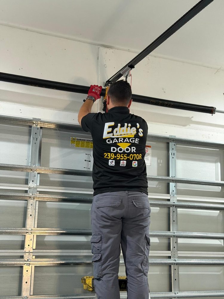 Eddie&rsquo;s Garage Door technician working on a residential door